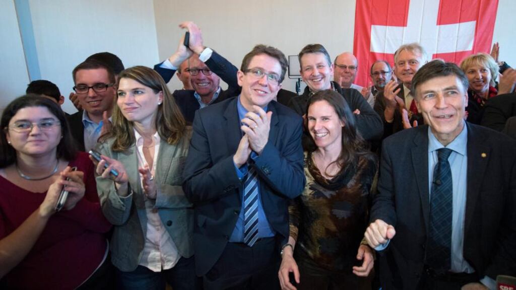 Senior figures in the Swiss People’s Party  cheer the results of the referendum  to limit EU migration to the country. Photograph: EPA/Marcel Bieri