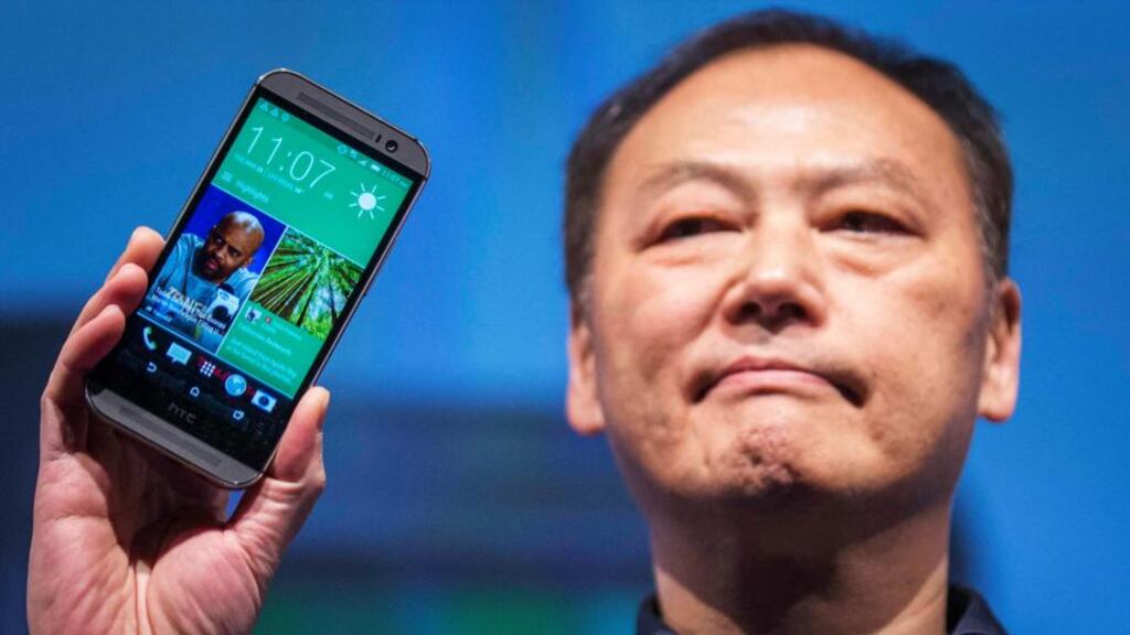 HTC chief executive Peter Chou shows off the new HTC One smartphone. Photograph: Brendan McDermid/Reuters