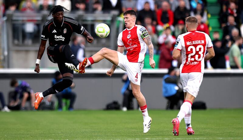 Pats' Joe Redmond and Tammy Abraham of Beşiktaş. Photograph: Ryan Byrne/Inpho