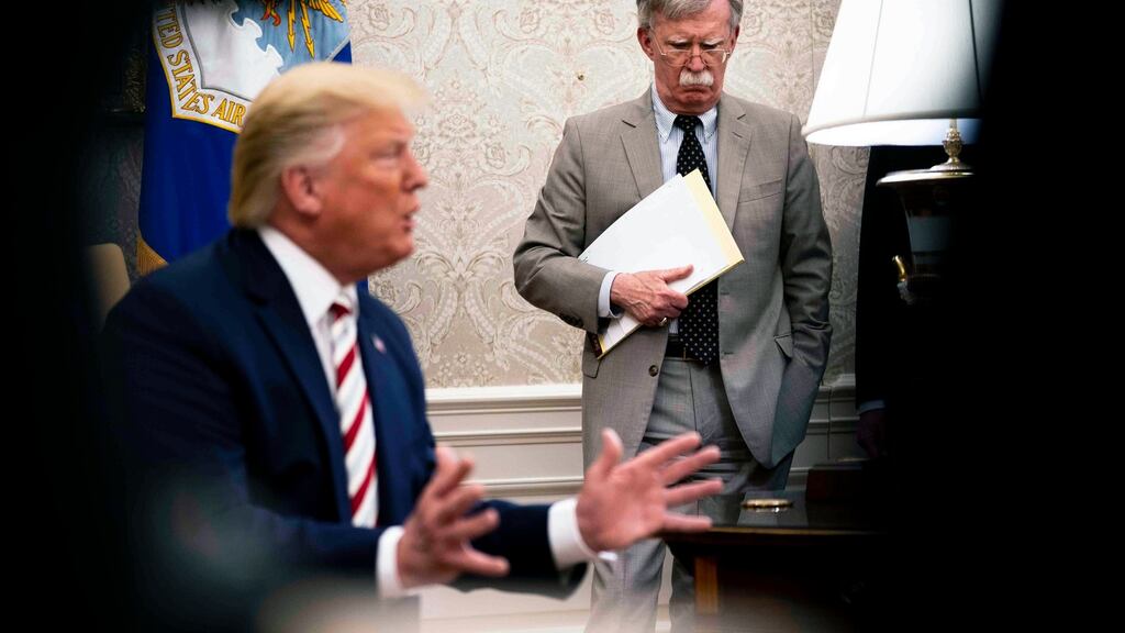 President Donald Trump and his former national security adviser John Bolton: Bolton’s departure was welcomed by many Trump allies who feared he could lead America into further conflict. Photograph: Doug Mills/New York Times