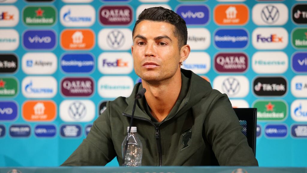 Cristiano Ronaldo snubbed Coca Cola for water. Photograph: EPA