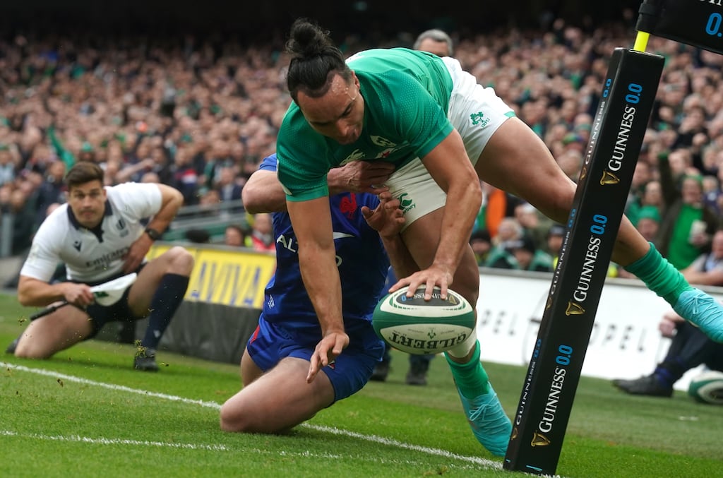 Ireland's James Lowe is tackled by France's Damian Penaud on the way to scoring his side's second try during the Six Nations match at the Aviva Stadium. Photograph: Brian Lawless/PA Wire
