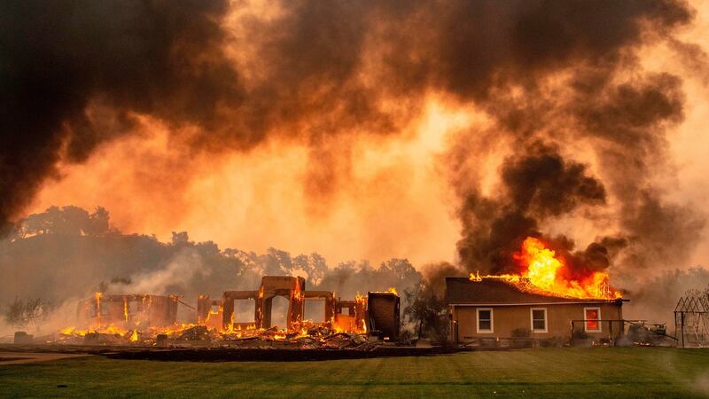 A building is engulfed in flames at a vineyard during the Kincade Fire near Geyserville, California. Photograph: Josh Edelson/AFP via Getty Images