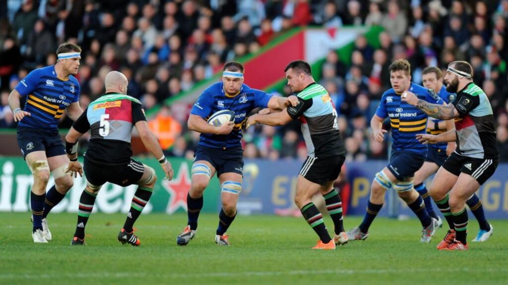 Leinster’s Rhys Ruddock  hands off Harlequins’ Dave Ward (centre right) during the Pool Two Champions Cup match at the  Stoop, Twickenham.