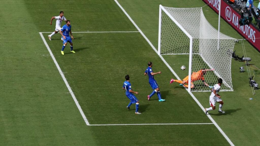 Costa Rica’s Bryan Ruiz heads home past Italy goalkeeper Gianluigi Buffon during the Group D game at Arena Pernambuco in Recife, Brazil. Photograph: Michael Steele/Getty Images