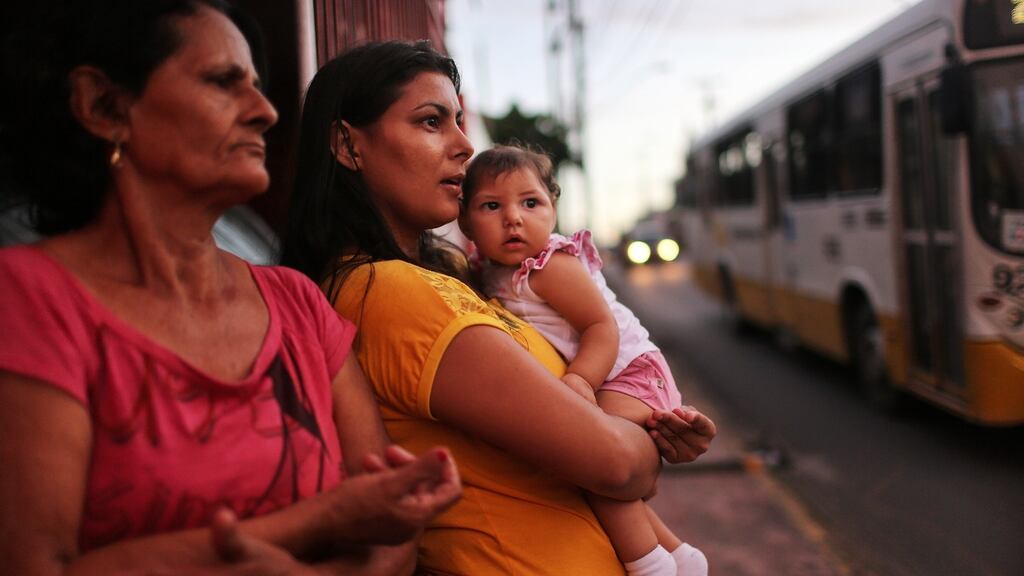 Jusikelly da Silva holds her 7-month-old daughter Luhandra, who was born with microcephaly, in Recife, Brazil. Photograph  Mario Tama/Getty Images