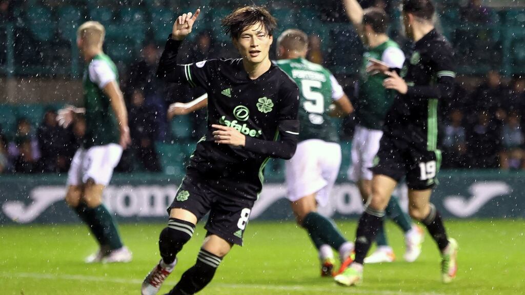 Celtic’s Kyogo Furuhashi celebrates scoring his side’s third against Hibs. Photograph: Jeff Holmes/PA