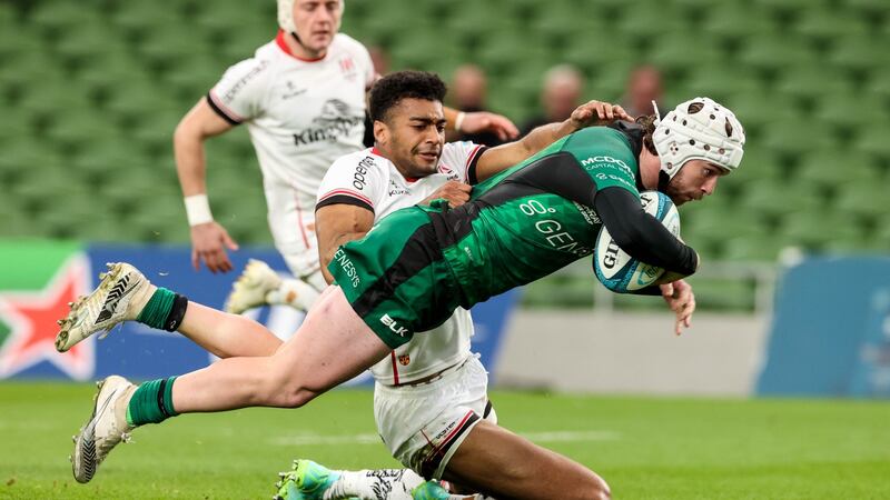 Connacht’s Mack Hansen scores a try despite the attempts of Ulster’s Robert Baloucoune during the United Rugby Championship match at the Aviva Stadium. Photograph: Billy Stickland/Inpho