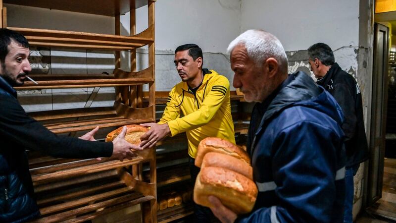 People receive free bread from a bakery in the city of Stepanakert, Nagorno-Karabakh, that reportedly runs 24 hours a day. Photograph: Aris Messinis/AFP/Getty