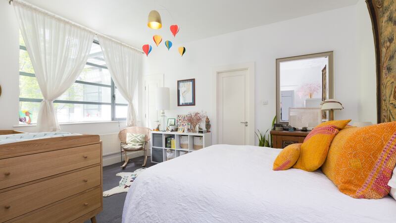 The bedroom has a large en suite with a bath and a huge walk-in wardrobe