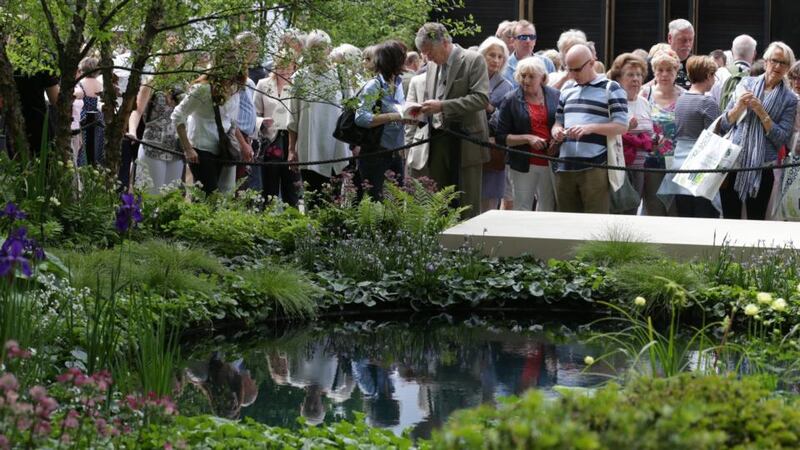 Visitors gather to admire the ABF The Soldiers’ Charity Gold Award winning garden at the RHS Chelsea Flower Show in the grounds of the Royal Hospital Chelsea. Photograph: Matt Cardy/Getty Images