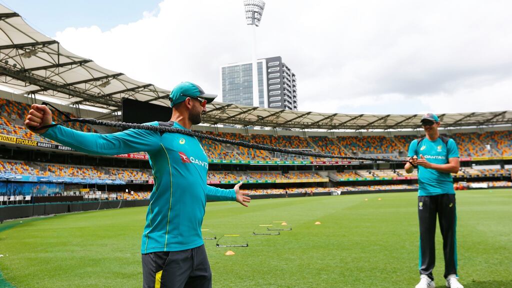 Australia’s Nathan Lyon warms up during a nets session at the Gabba in Brisbane. Photograph : Jason O’Brien/PA