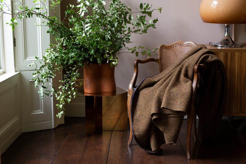 Handwoven merino wool blanket with leather trim, €390, from stableofireland.com