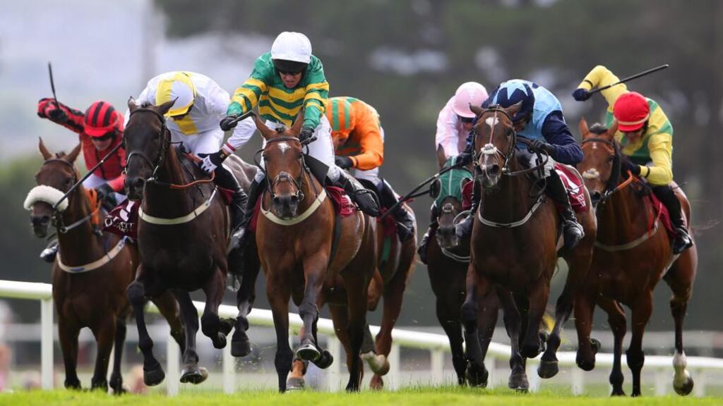 Jockey Barry Geraghty onboard Jacksonslady, on his way to winning The Latin Quarter Steeplechase at the 2014 the Galway Racing Festival, Ballybrit. Photograph: Cathal Noonan/Inpho