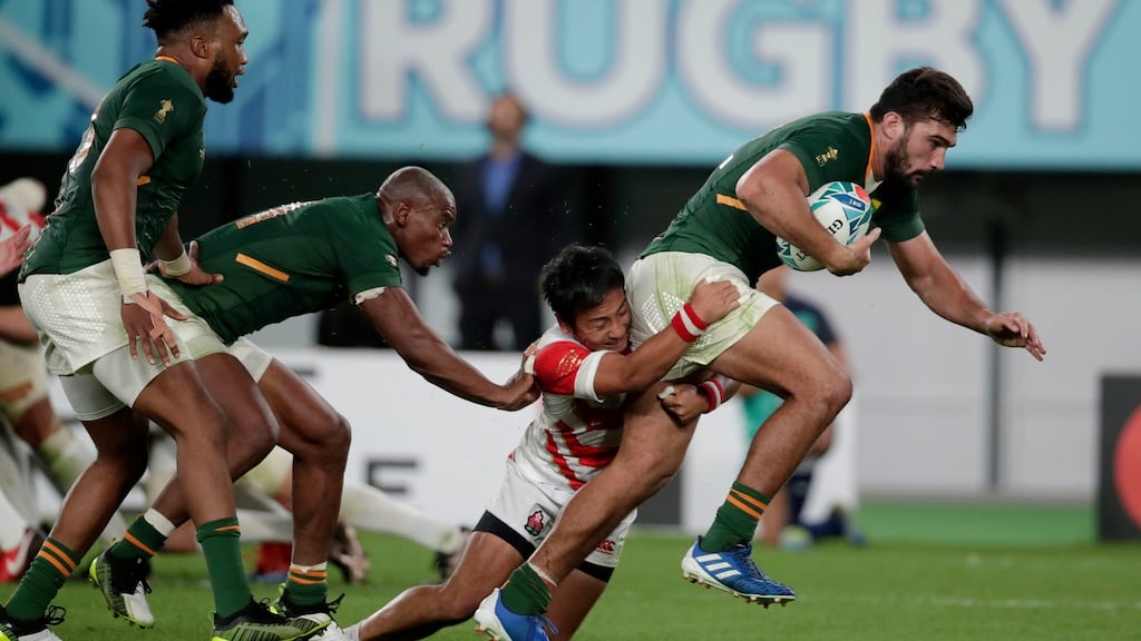 Japan’s Yutaka Nagare attempts to tackle South Africa’s Damian de Allende during the Rugby World Cup quarter-final at Tokyo Stadium. Photo: Odd Andersen/Getty Images