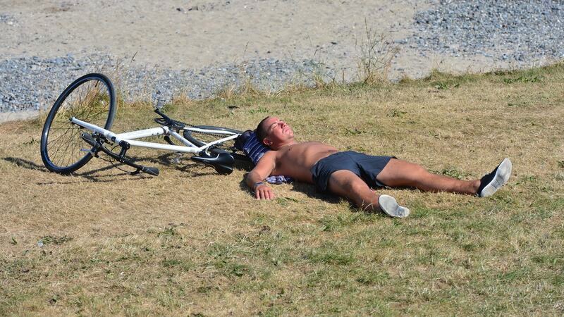 Alex Kucovs from Latvia takes a break on Portmarnock Beach. Photograph: Alan Betso/The Irish Times