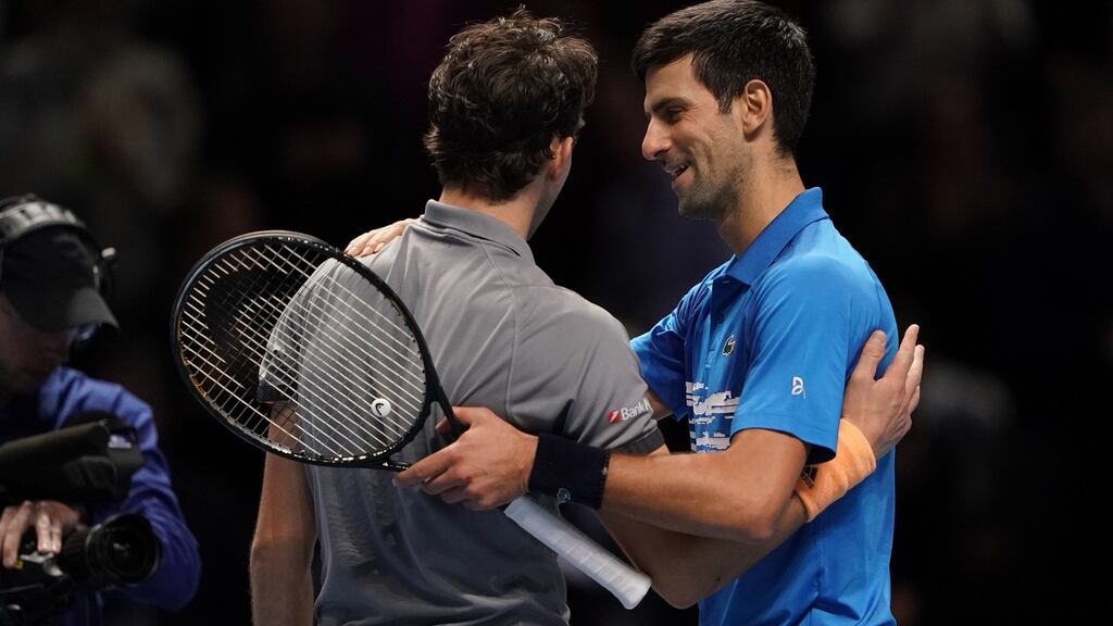 Dominic Thiem and Novak Djokovic embrace after their match at The O2 Arena, London. Photograph: PA