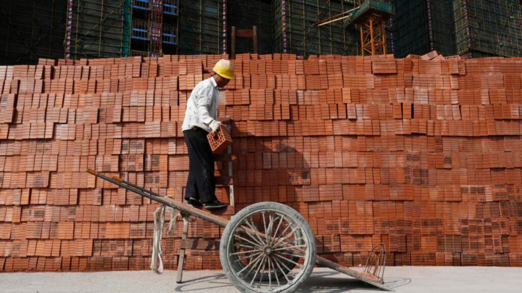 A labourer works at a construction site in Hangzhou, Zhejiang province. China’s economy grew at its slowest pace in 18 months in the first quarter of 2014, official data showed on Wednesday. Photograph: William Hong/Reuters
