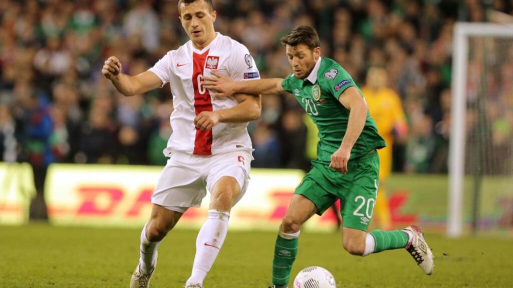 Republic of Ireland midfielder Wes Hoolahan holds off the challenge of Poland’s Tomasz Jodlowiec during the Euro 2016 Group D qualifying at the Aviva Stadium. Photograph: Morgan Treacy/Inpho