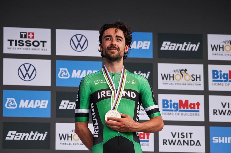 Bronze medallist Ben Healy poses on the podium following the men's elite road race cycling event during the UCI 2025 Road World Championships, in Kigali. on September 28, 2025. Photograph: Anne-Christine Poujoulat/  via Getty Images