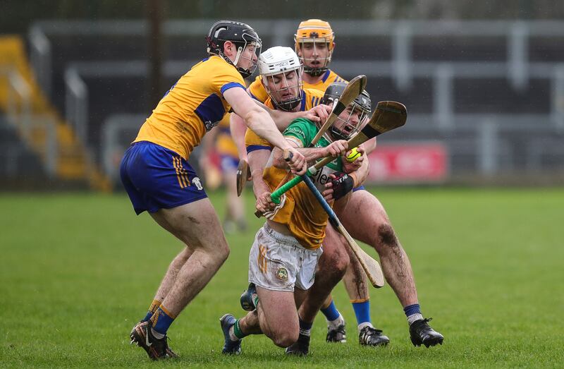 David Nally of Offaly in action against John Conneally and Ross Hayes of Clare. Photograph: Natasha Barton/Inpho