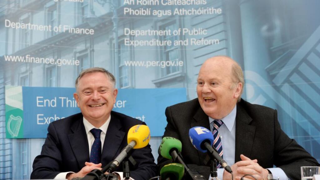 Ministers Brendan Howlin and Michael Noonan: the Department of Finance has disputed analysis from stockbroker economists about  budget day “giveaways”. Photograph: Alan Betson