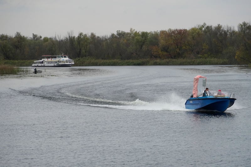 Civilians evacuated from the city of Kherson, which Moscow claims to have annexed, arrive in the neighbouring town of Oleshky after crossing the Dnipro river on a passenger boat. Photograph: AFP