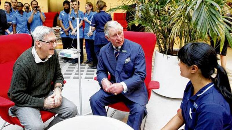 Patron of the Macmillan Cancer Support, Prince Charles, with nurses during a visit to the University College Hospital in London. photographs: macmillan cancer support/richard lewis