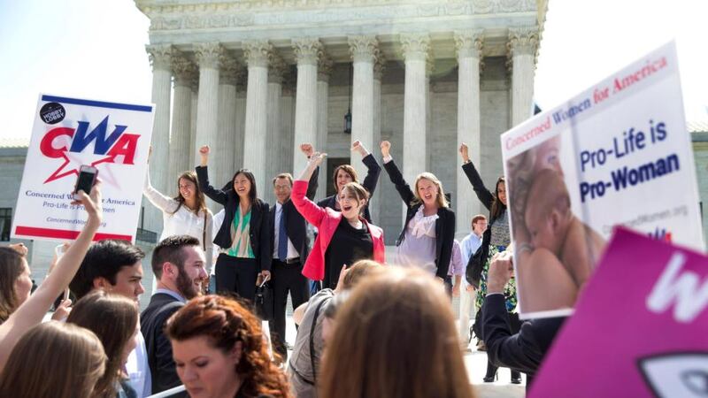Hobby Lobby’s legal team celebrate outside the Supreme Court in Washington after the ruling. Photograph: Doug Mills/The New York Times
