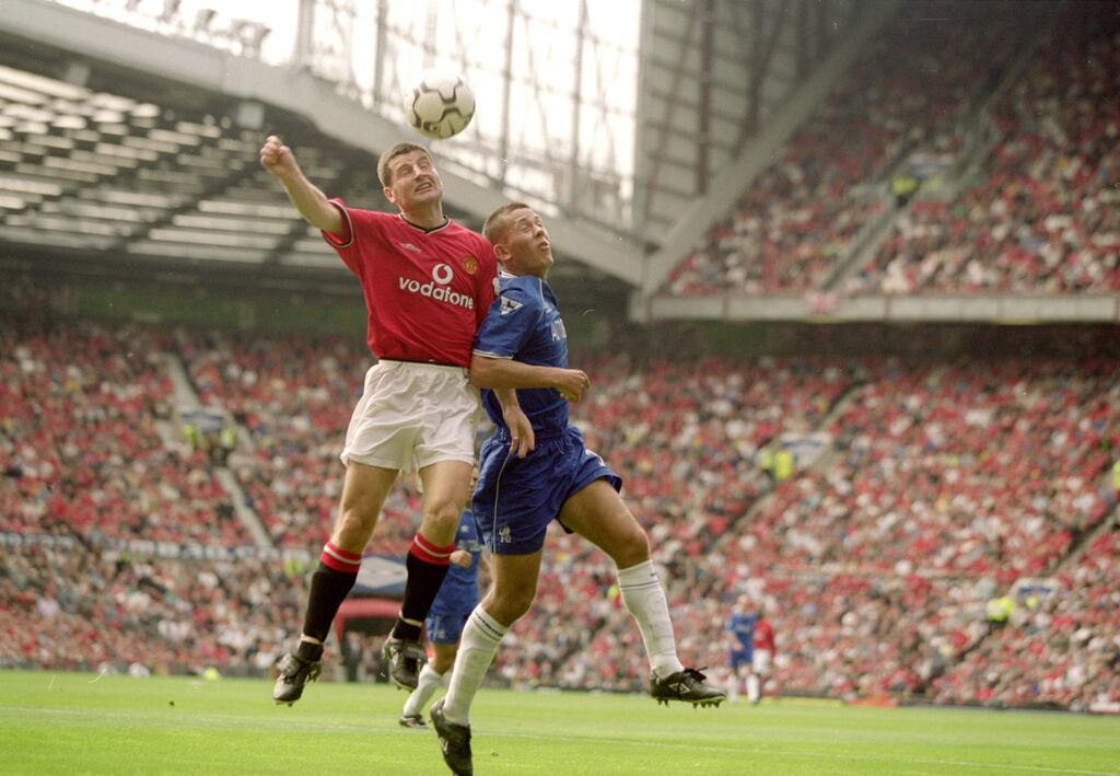 Denis Irwin in action for Manchester United against Jon Harley of Chelsea in September 2000. Photograph: Ben Radford/Allsport