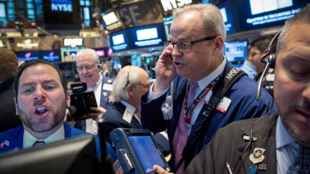 NYSE traders: Critics say cap-weighted indices run the risk of significant declines if a handful of constituent stocks tumble and that tracker funds will end up being too invested in overpriced stocks, and too little in underpriced stocks. Photograph: Brendan McDermid/Reuters
