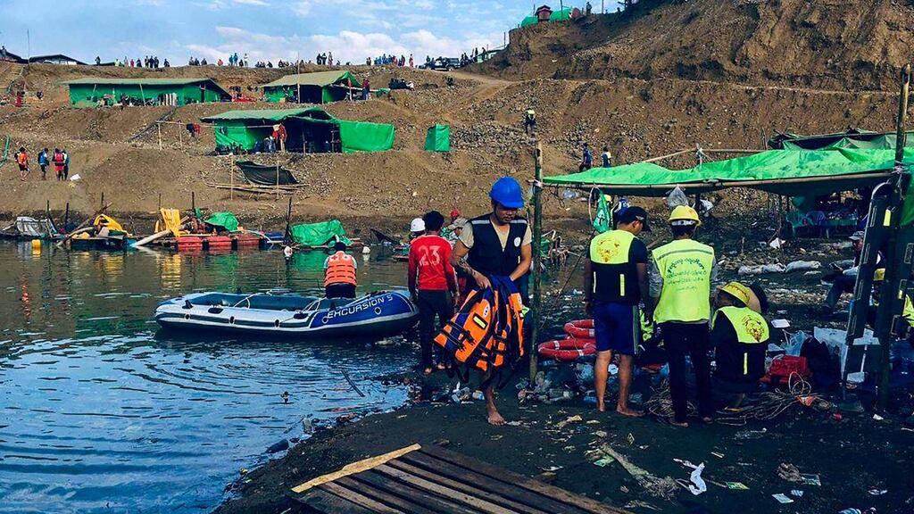 Rescue officials taking part in a search for missing people after a landslide at a jade mine in Hpakant, Kachin state, Myanmar. Photograph: AFP via Getty Images