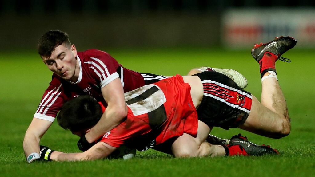 St. Mary’s Aaron Boyle clashes with Conor Horgan of UCC during the Sigerson Cup final. Photo: James Crombie/inpho