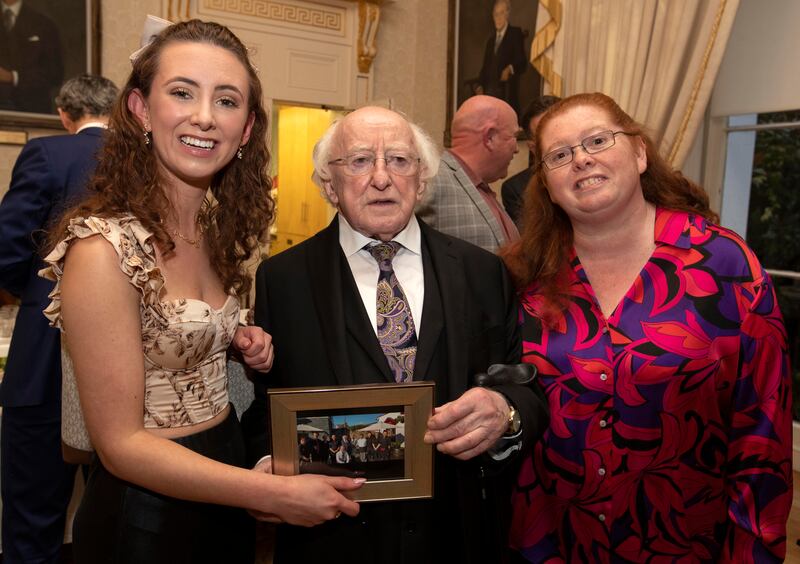 President Michael D Higgins with Lauren Burke and her mother, Gillian Burke. Lauren lost her father, Derek Horan, in 2021 in a car accident in Maynooth, Co Kildare. Photograph: Colin Keegan, Collins Dublin