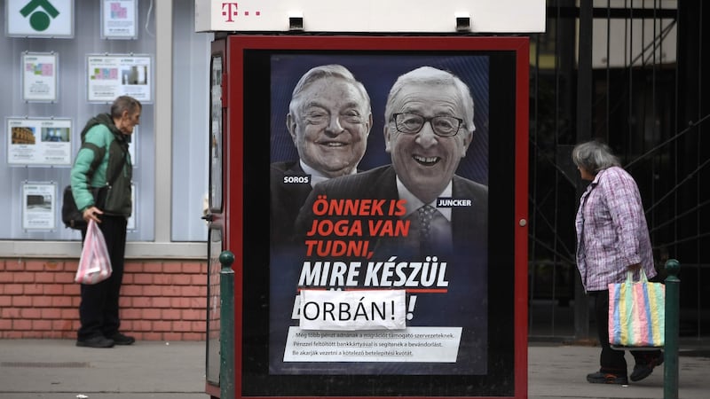 Posters put up by Victor Orbán’s Fidesz party, attacking Jean-Claude Juncker and Hungarian-born US investor and philanthropist George Soros. Photograph: Attila Kisbenedek/AFP/Getty Images