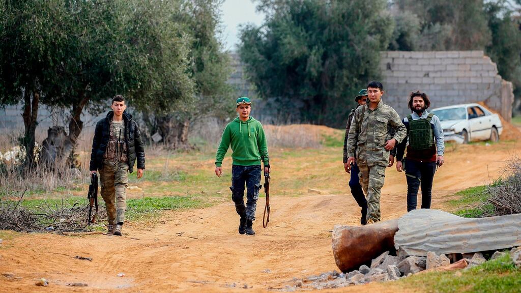 Fighters loyal to the internationally recognised Libyan Government of National Accord patrol an area south of Tripoli. Photograph: Getty