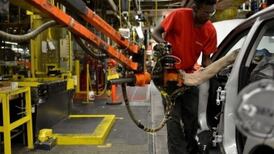 US October job growth slows less than expected