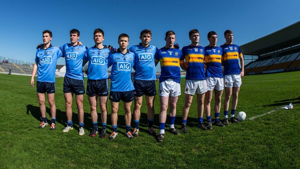 Dublin and Tipperary stand together before the game as they observe a minute’s silence for the late Dave Billings. Photograph: Cathal Noonan/Inpho