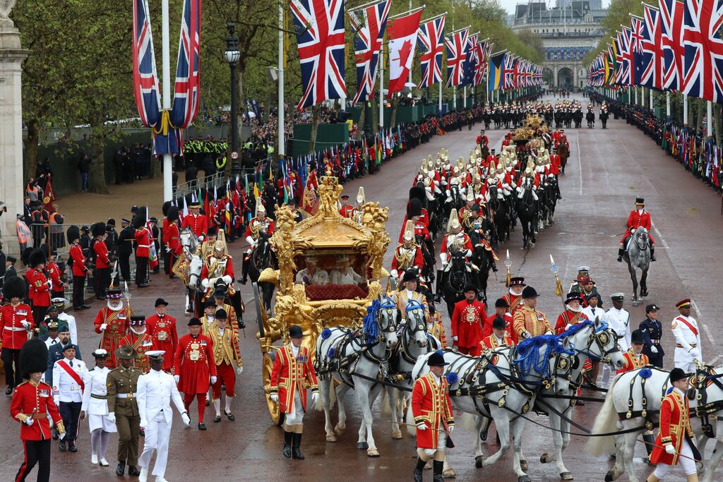 King Charles III and Queen Camilla travel down the Mall towards Buckingham Palace following their coronation ceremony in London on Saturday. Photograph: EPA