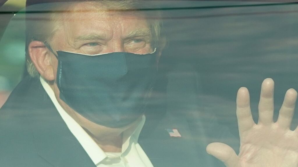 US President Trump in a motorcade outside Walter Reed Medical Center on Sunday. Photograph: Alex Edelman/AFP/Getty Images.