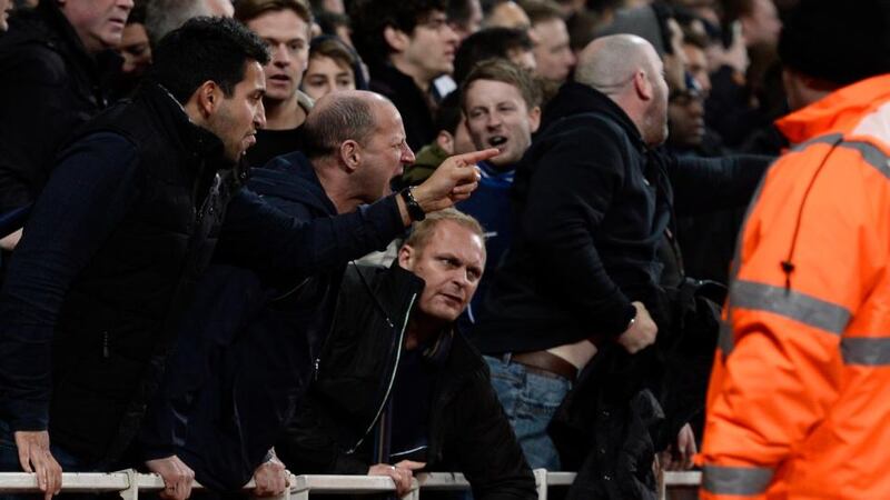 Tottenham Hotspur supporters react as Arsenal’s Theo Walcott is stretchered off the pitch during their English FA Cup soccer match at Emirates Stadium. Photograph: Dylan Martinez/Reuters