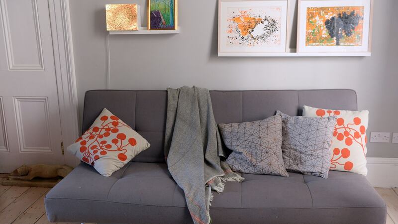 Sofa from Northern India, with paintings by Paul Mosse, and a Hockney print and Joy Gerard lightbox. Photograph: Eric Luke