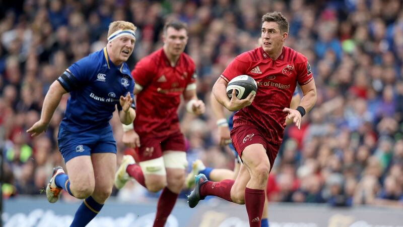 Ian Keatley gets away from James Tracyto score a try. Photo: Dan Sheridan/Inpho