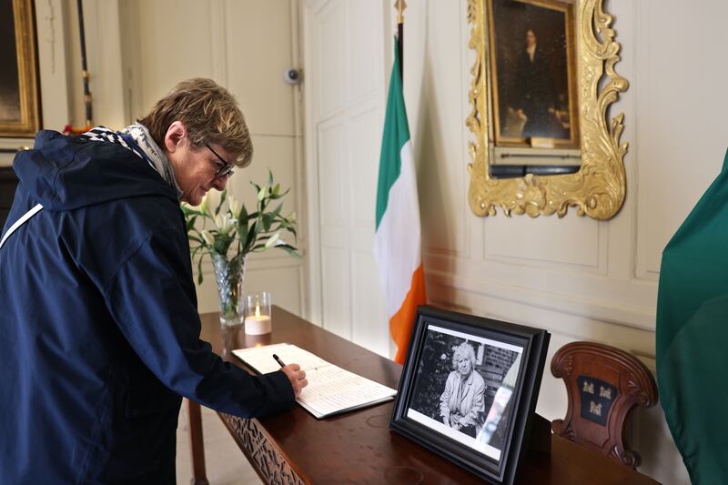Eileen Scanlan from Dundrum signs the book in the Mansion House. Photograph: Dara Mac Dónaill/The Irish Times