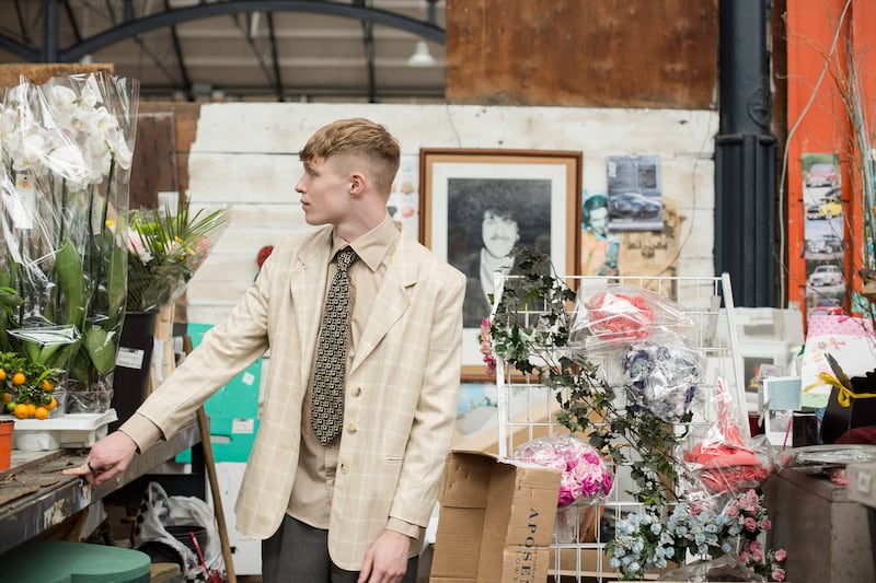 Ivory check suit jacket €6, Dublin Vintage, Capel Street, Dublin 1; nude high-collar shirt €4, Age Action, Camden Street, Dublin 8; geometric tie €2, Age Action; grey suit trousers €10, Oxfam, South Great George’s Street, Dublin 2
