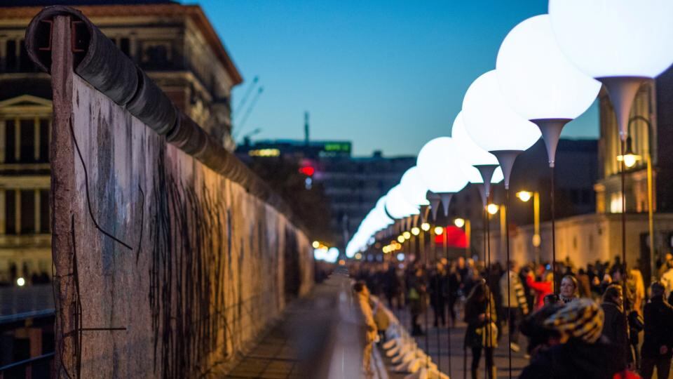 Thousands of people look at the balloon lanterns at remains of the Berlin Wall at Topography of Terror Documentation Center between Martin Gropius Building and the Berlin state parliament in Berlin. Photograph: Bernd Von Jutrczenka/EPA