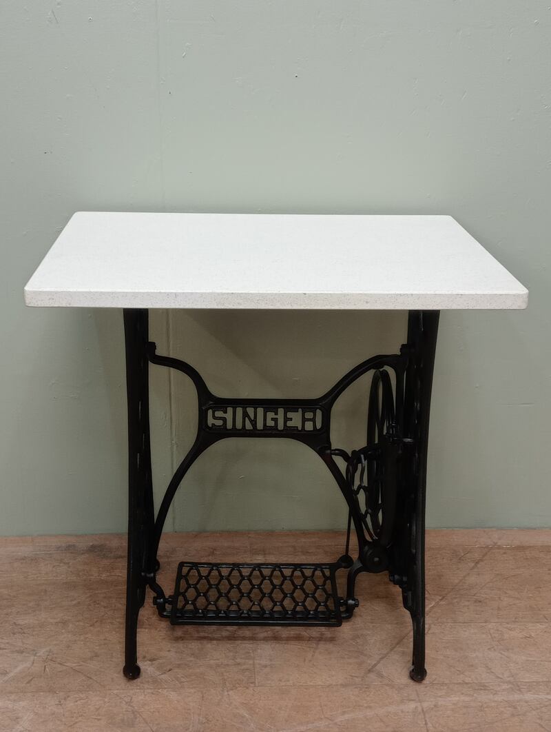 The Singer sewing machine table with a marble top (€120-€220)