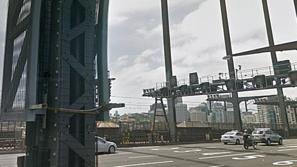 Police found the injured man lying on the road under the High Street overpass at North Sydney