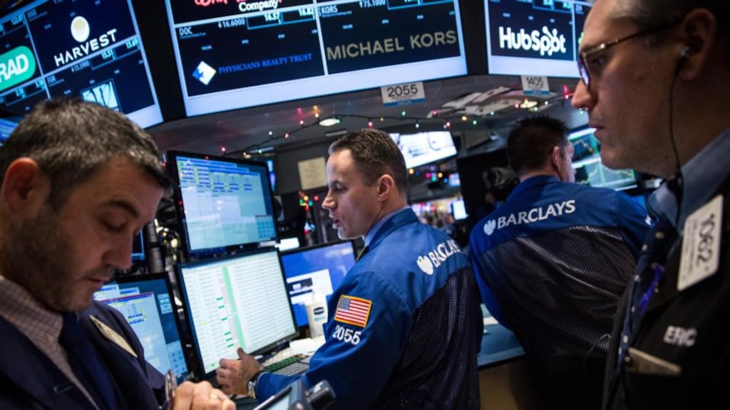 Traders work on the floor of the New York Stock Exchang.  Photograph: Andrew Burton/Getty Images