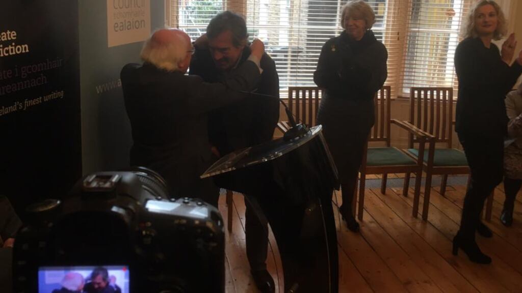 President Michael D Higgins presents Sebastian Barry with his Laureate medal “struck in the smithy of kindness and care”